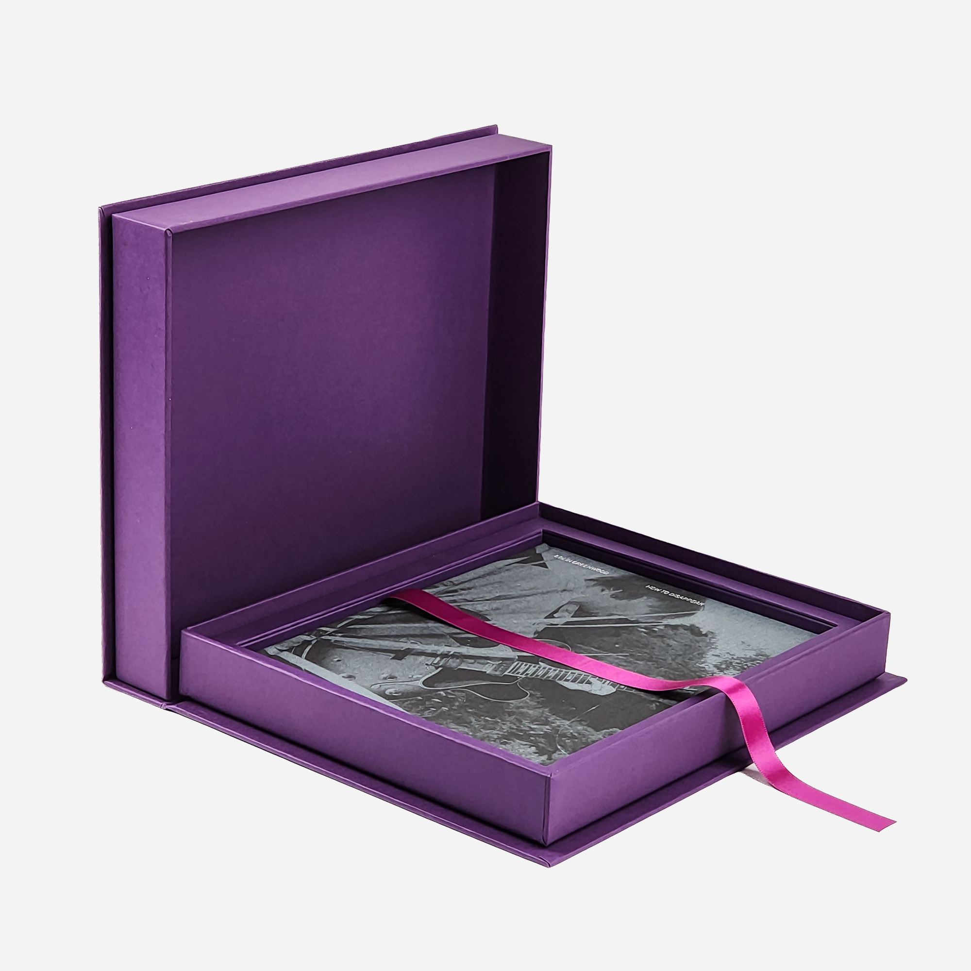 The presentation case open to show the volumes inside.