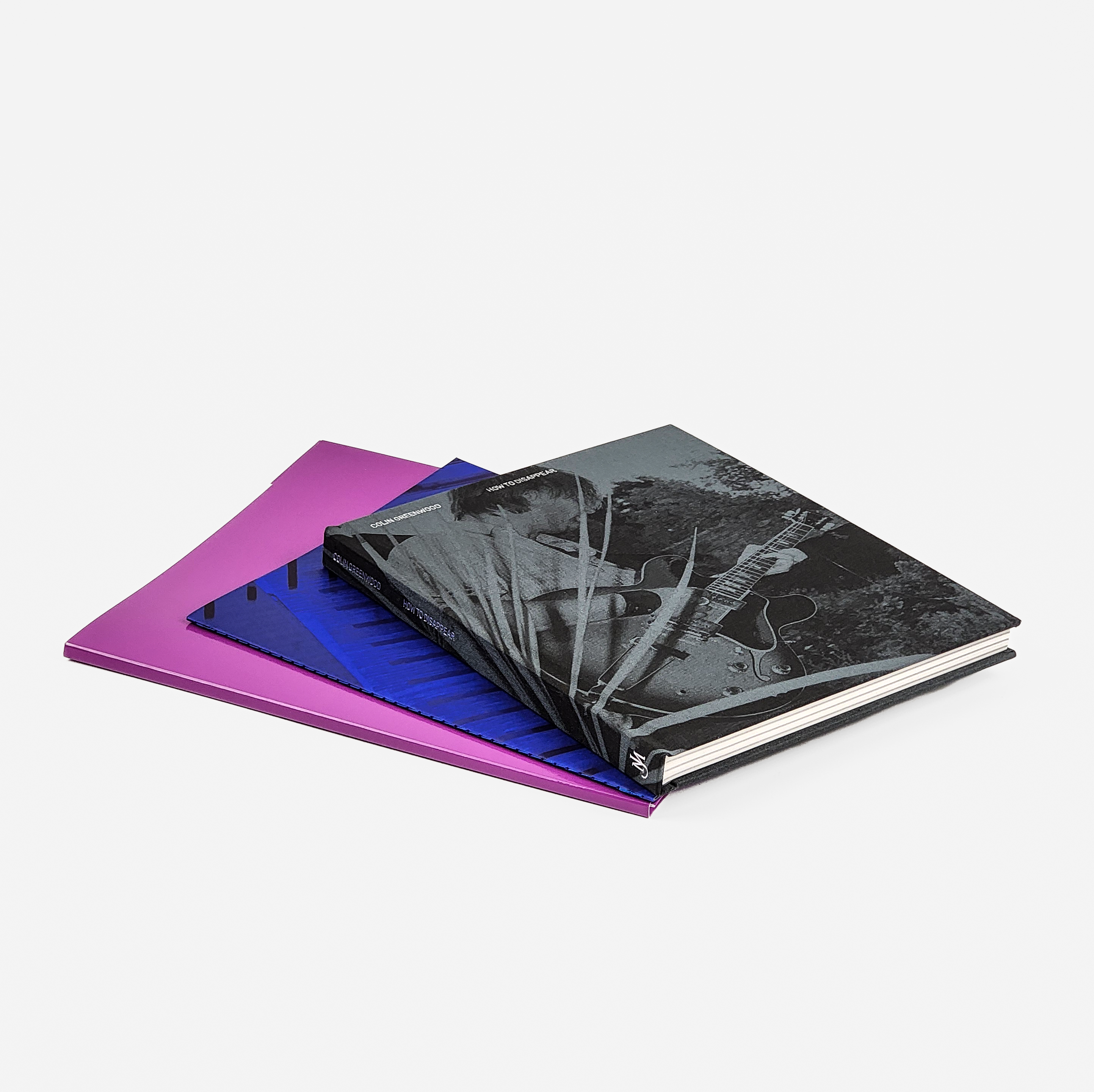 The book, accompanying photographic pamphlet, and case for signed photographic prints.