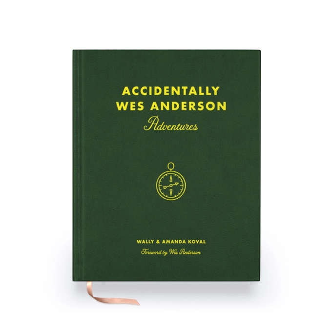 The green slipcase of the deluxe edition, featuring gold lettering.