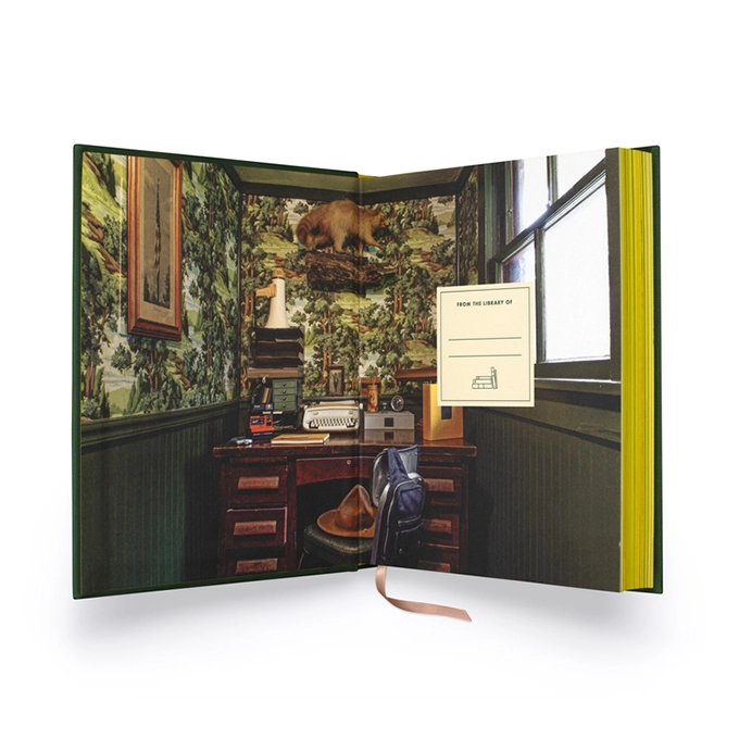 The photographic endpapers and stained edges of the edition.